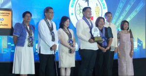 Mambajao Mayor Yñigo Jesus Romualdo (center) personally received the town's recognition as the second most competitive municipality for the 3rd to 4th class municipalities during the 2024 Creative Cities and Municipalities Congress on August 23. (Photo courtesy of CMCI)
