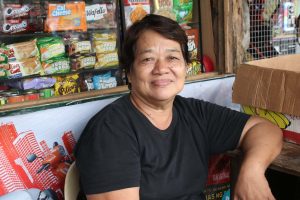 Abing Damasco, a fruit vendor and sari-sari store owner near the entrance of Panguil Bay Bridge expresses her excitement for the changes it will bring to their daily lives and businesses. (Photo: ADD/PIA-10/Lanao del Norte)
