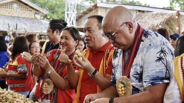Rep. Jurdin Jesus Romualdo (center) showcased the abundant harvest of Lanzones at the Ugmad Site, Cong. PPR Tourism and Sports Complex on October 20. (Photo courtesy of PGO)