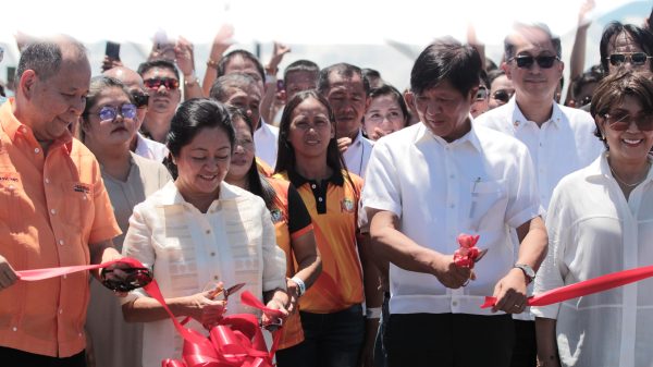 President Ferdinand Marcos Jr. and First Lady Louise Araneta-Marcos, along with Department of Public Works and Highways Secretary Manuel M. Bonoan, drive through the newly inaugurated Panguil Bay Bridge, warmly welcomed by various sectors set to benefit from this vital infrastructure. (Photo: JAKA/PIA-10/Lanao del Norte)