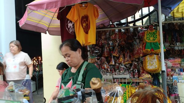A vendor outside the Jesus Nazareno Parish-Shrine of the Black Nazarene readies for the possible influx of devotees on January 9 in time for the Traslación and Feast of the Black Nazarene. (Photo: PIA-10)